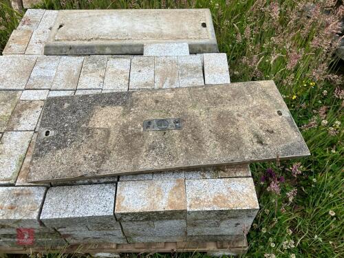 2 CONCRETE FILLED DRAIN COVERS