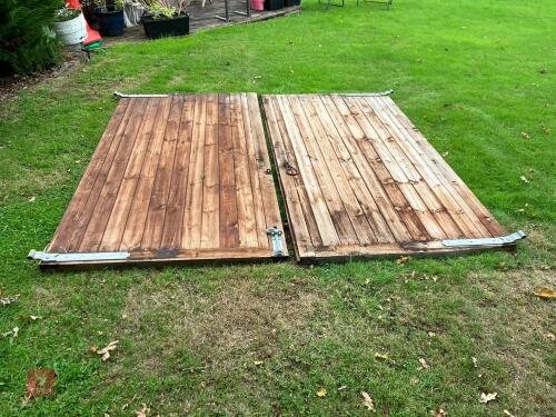 PAIR OF WOODEN GARAGE DOORS