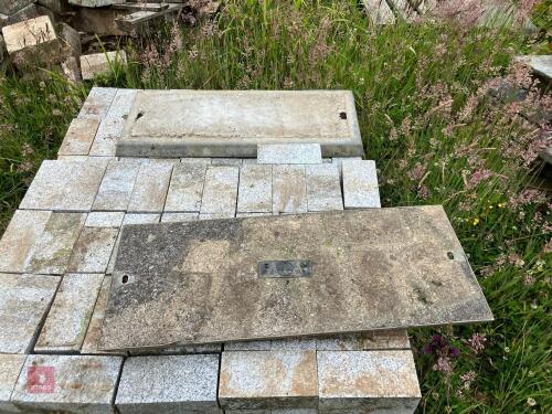 2 CONCRETE FILLED DRAIN COVERS