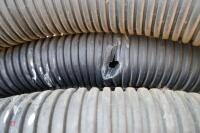 ROLL OF BLACK PLASTIC 4'' DRAINAGE PIPE - 3