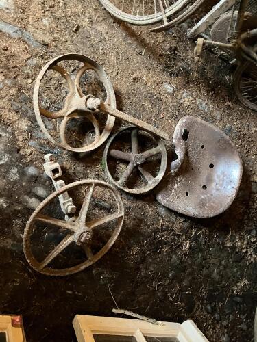 VINTAGE CAST TRACTOR SEAT & 3 WHEELS