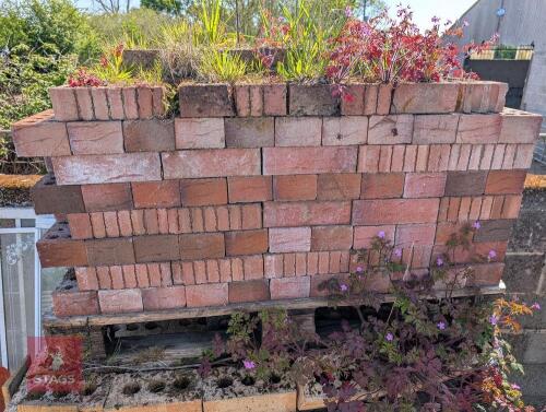 HALF A PALLET OF RED BRICKS