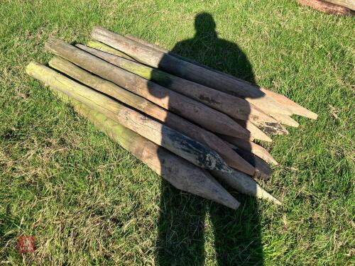 13 WOODEN ROUND FENCE STAKES