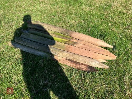 12 WOODEN ROUND FENCE STAKES