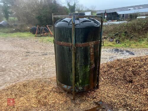 BLACK PLASTIC JUICE TANK IN CAGE