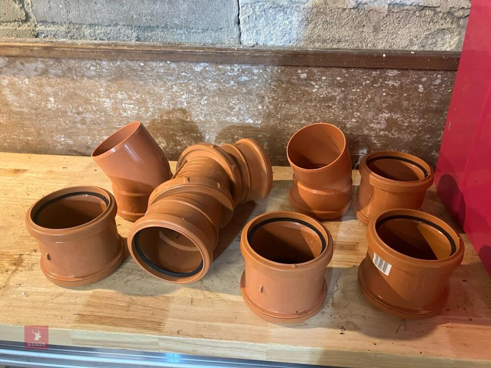 BOX OF PLASTIC GUTTER FITTINGS